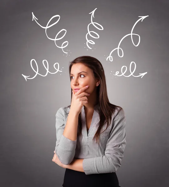 Young woman thinking with arrows overhead — Stock Photo, Image