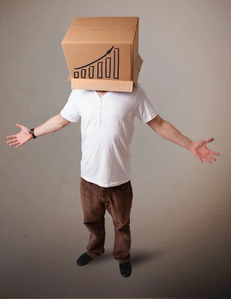 Genç adam diagra ile kafasına bir karton kutu ile el hareketi — Stok fotoğraf