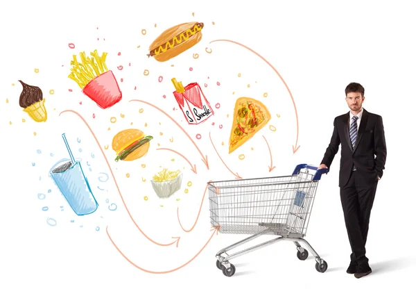 Man with shopping cart with toxic junk food — Stock Photo, Image