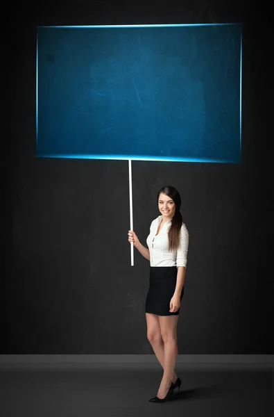 Businesswoman with blue board — Stock Photo, Image