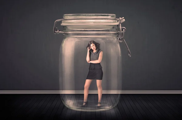 Businesswoman trapped into a glass jar concept — Stock Photo, Image