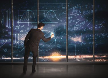 İş adamı iş grafikleri çiziyor