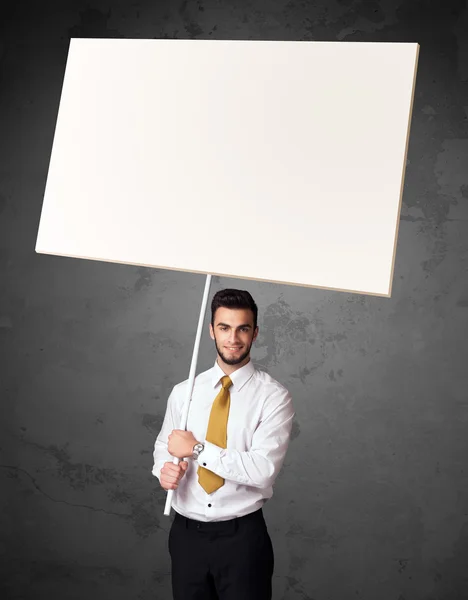 Businessman with blank whiteboard — Stock Photo, Image