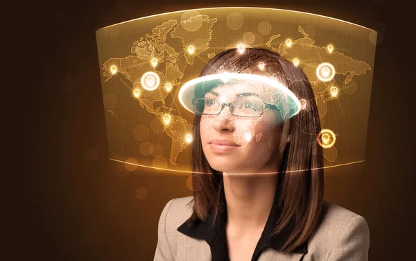 Young woman looking at futuristic social network map — Stock Photo, Image