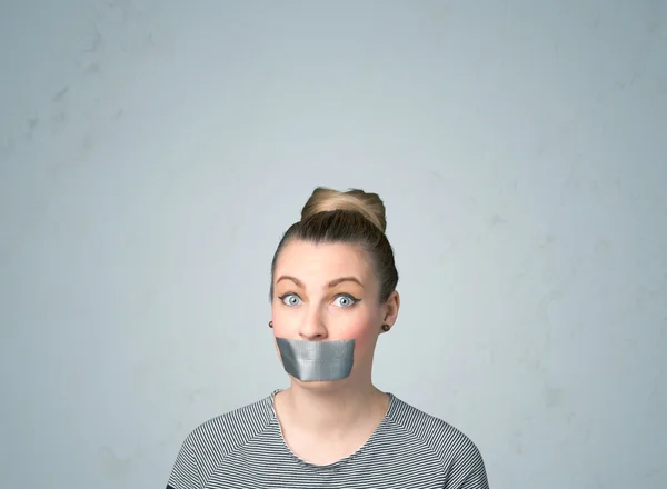 Young woman with glued mouth — Stock Photo, Image