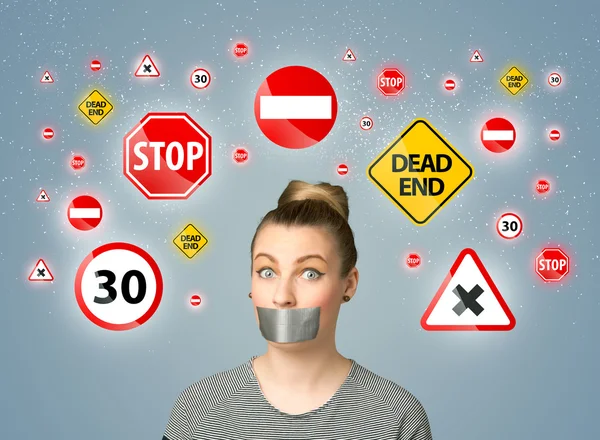 Young woman with glued mouth and traffic signals — Stock Photo, Image