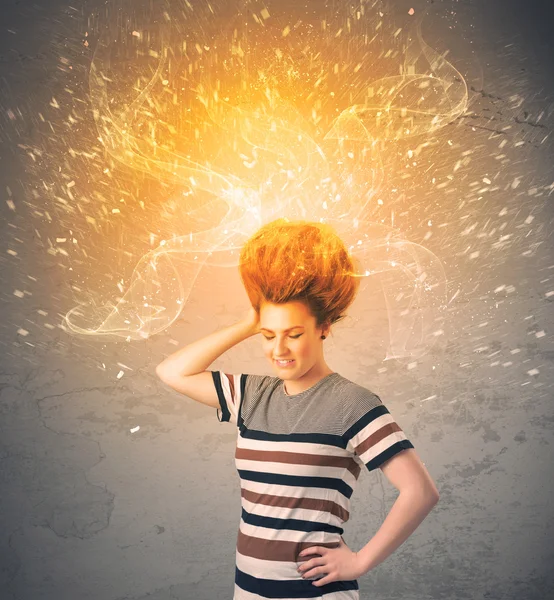 Young woman with energetic exploding red hair — Stock Photo, Image