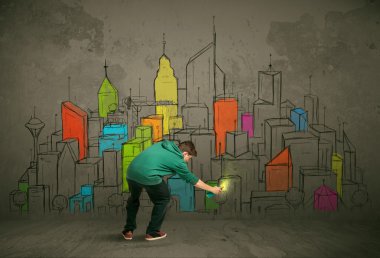 Genç şehir ressamı çiziyor