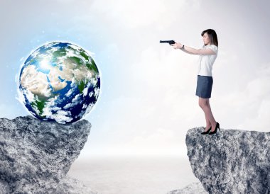 Businesswoman on rock mountain with a globe clipart