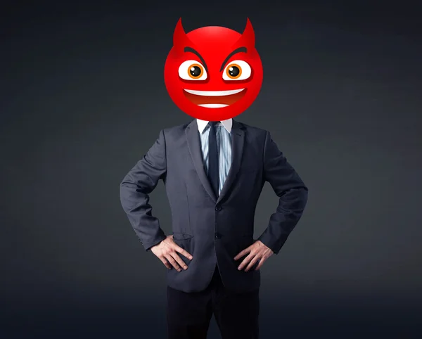 Businessman wears devil smiley face — Stock Photo, Image