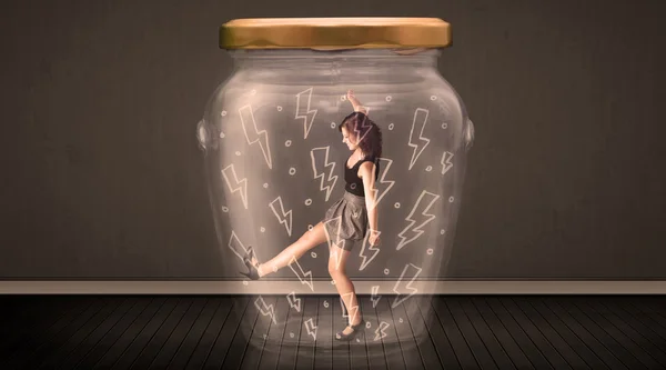 Businesswoman inside a glass jar with lightning drawings concept — Stock Photo, Image