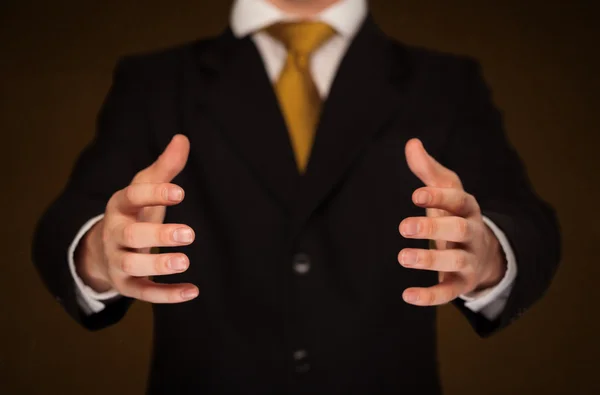 Businessman holding something — Stock Photo, Image