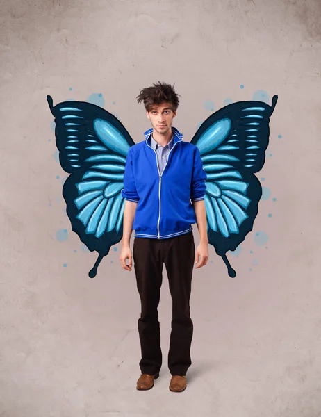Handsome young man with butterfly blue illustration on the back — Stock Photo, Image