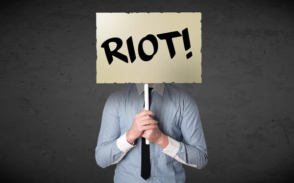 Businessman holding a protest sign — Stock Photo, Image