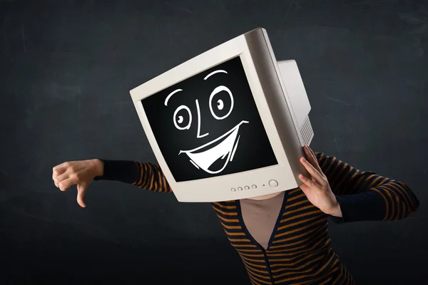 Girl with a monitor head and a cheerful cartoon face — Stock Photo, Image