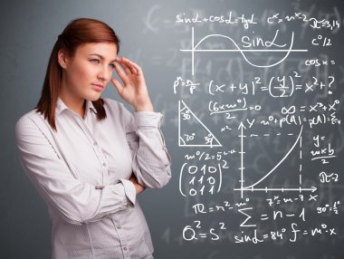 Karmaşık matematiksel işaretleri düşünen güzel bir kız öğrenci.