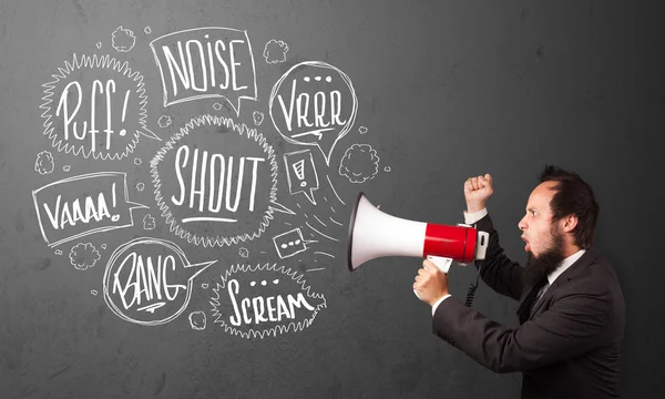 Guy in suit yelling into megaphone and hand drawn speech bubbles — Stock Photo, Image