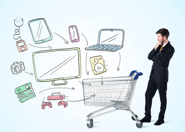 Businessman with shopping cart — Stock Photo, Image