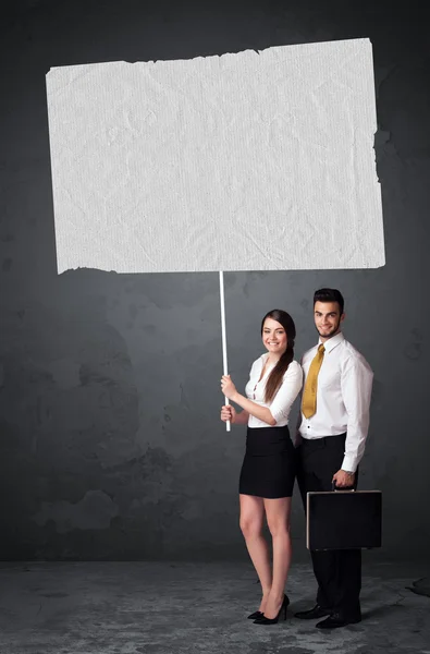 Business couple with blank booklet paper — Stock Photo, Image