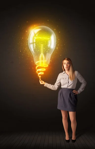 Businesswoman with an idea bulb — Stock Photo, Image