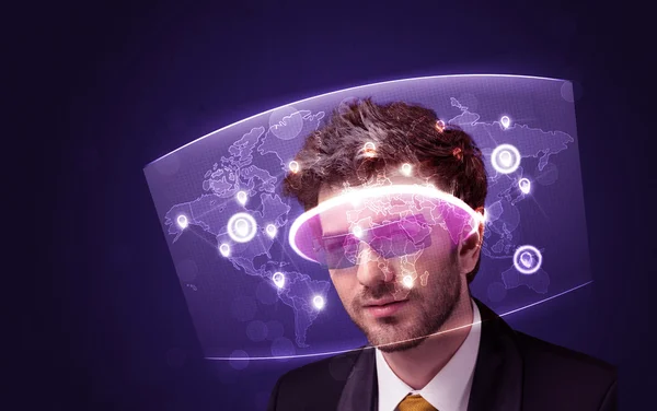 Young man looking at futuristic social network map — Stock Photo, Image