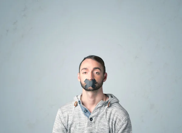 Young man with glued mouth — Stock Photo, Image