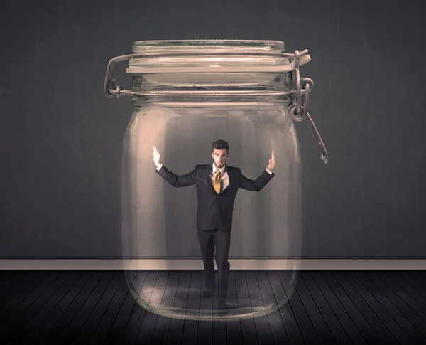 Businessman trapped into a glass jar concept — Stock Photo, Image