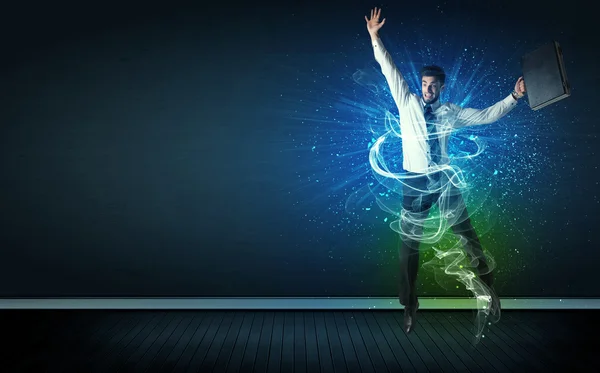 Talented cheerful businessman jumping with glowing energy lines — Stock Photo, Image