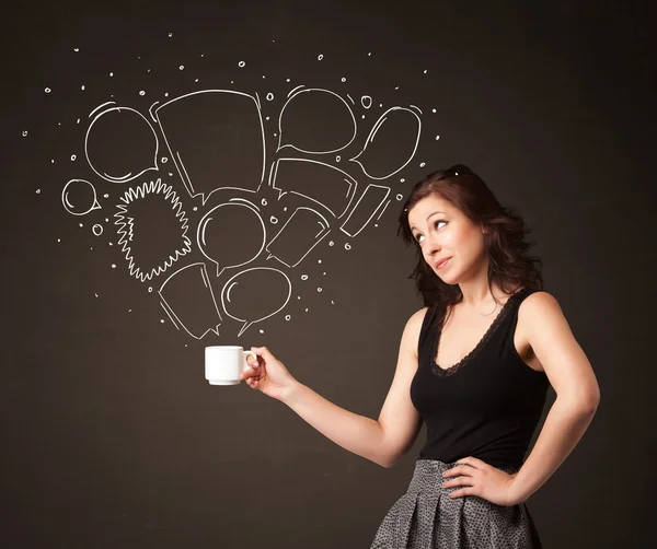 Businesswoman holding a white cup with speech bubbles — Stock Photo, Image