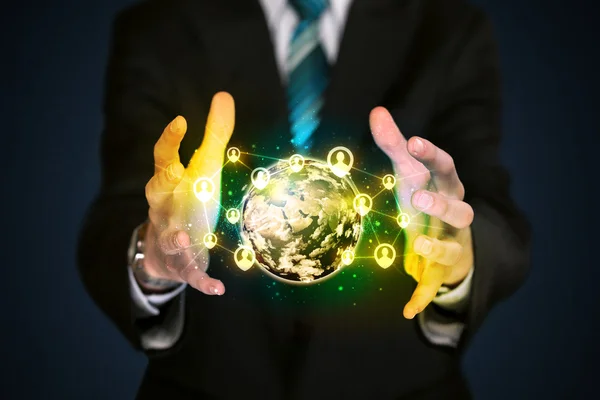 Businessman holding a social media globe — Stock Photo, Image