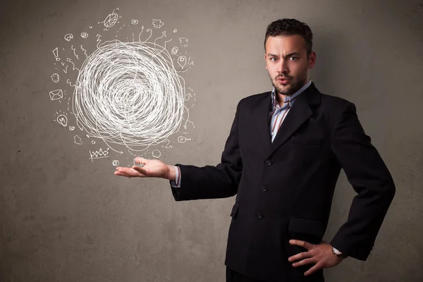 Chaos-Konzept in der Hand eines Geschäftsmannes — Stockfoto