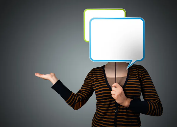 Young woman holding speech bubble — Stock Photo, Image