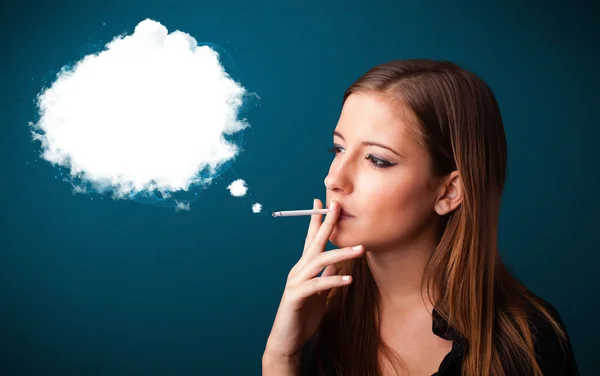 Young woman smoking unhealthy cigarette with dense smoke — Stock Photo, Image