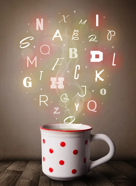 Coffee cup with colorful letters — Stock Photo, Image