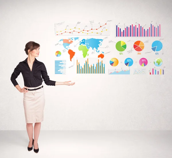 Business woman with colorful graphs and charts — Stock Photo, Image