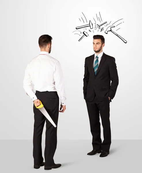 Businessman hiding a weapon — Stock Photo, Image