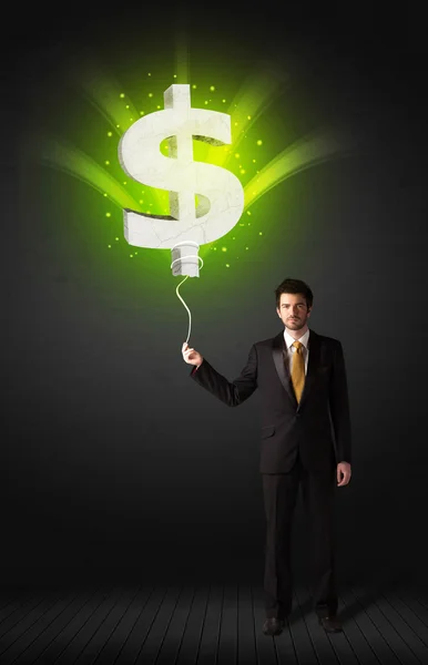 Businessman with a dollar sign balloon — Stock Photo, Image