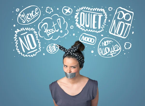 Young woman with glued mouth and thought clouds — Stock Photo, Image