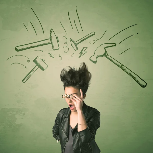 Tired woman with hair style and headache hammer symbols — Stock Photo, Image