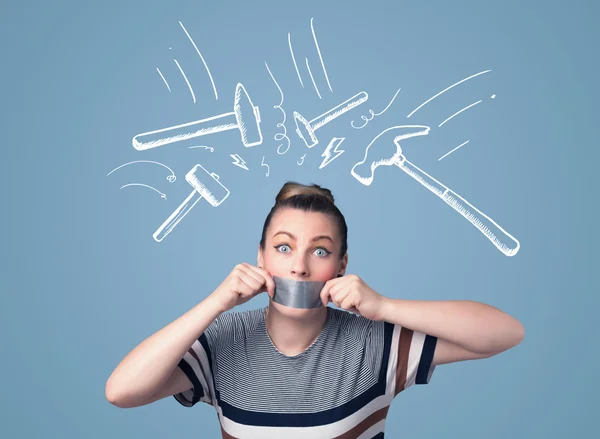 Young woman with glued mouth and hammer marks — Stock Photo, Image