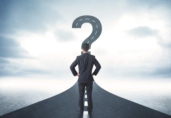 Business person lokking at road with question mark sign — Stock Photo, Image