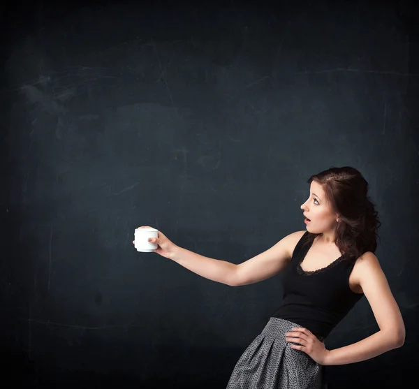 Businesswoman holding a white cup — Stock Photo, Image