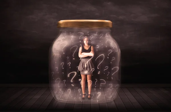 Businesswoman locked into a jar with question marks concept — Stock Photo, Image