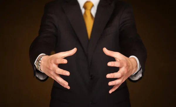 Businessman holding something — Stock Photo, Image