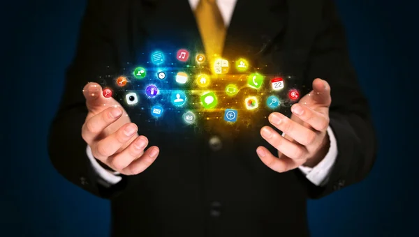 Businessman holding app icon cloud — Stock Photo, Image