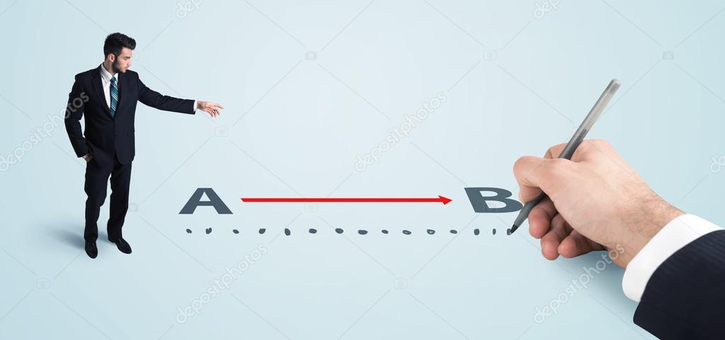 Businessman looking at red line from a to b drawn by hand