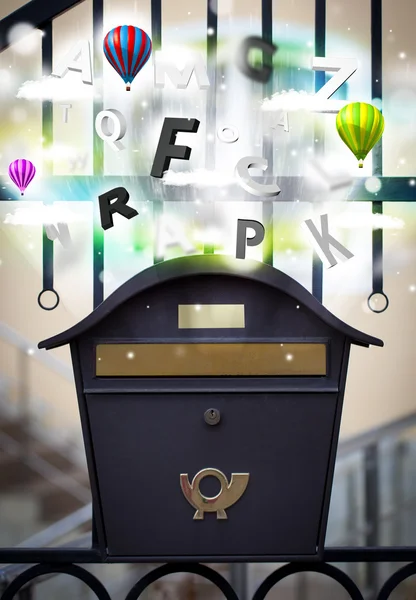 Post box with colorful letters — Stock Photo, Image