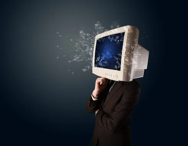 Computer monitor screen exploding on a young persons head — Stock Photo, Image