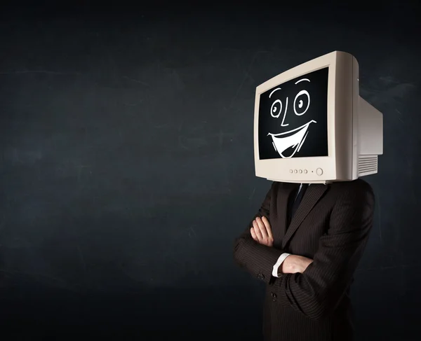 Hombre de negocios feliz con una cabeza de monitor de PC y una cara sonriente — Foto de Stock