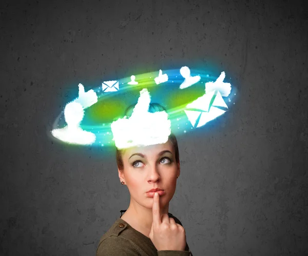 Young teenager with cloud social icons around her head — Stock Photo, Image